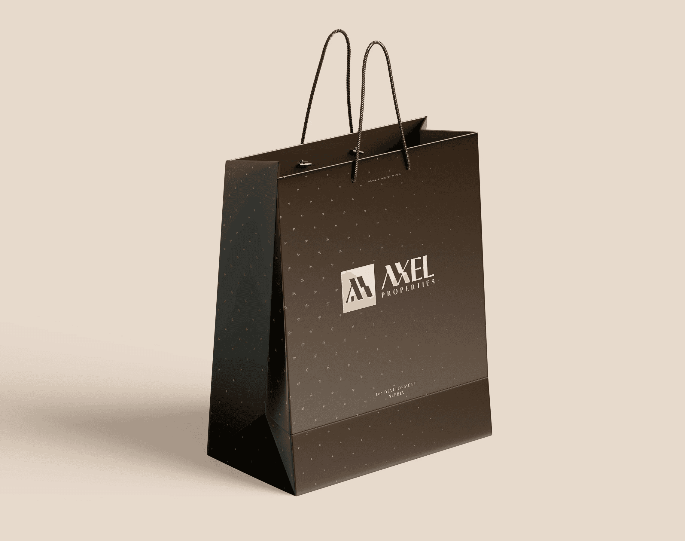 A brown paper bag with the cream lockup and the scattered pattern.